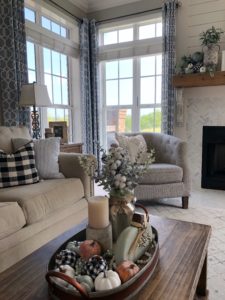 fall fireplace with buffalo check and sage green pumpkins for a farmhouse fall look and feel. easy diy foam painted pumpkins and some great decor finds to complete the look!