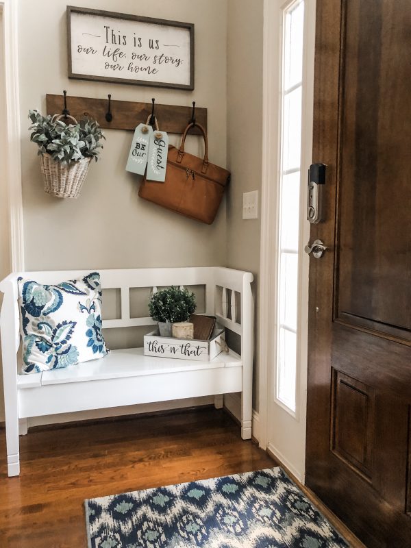Easy entry way decorating ideas using a storage bench, hooks and decor ...